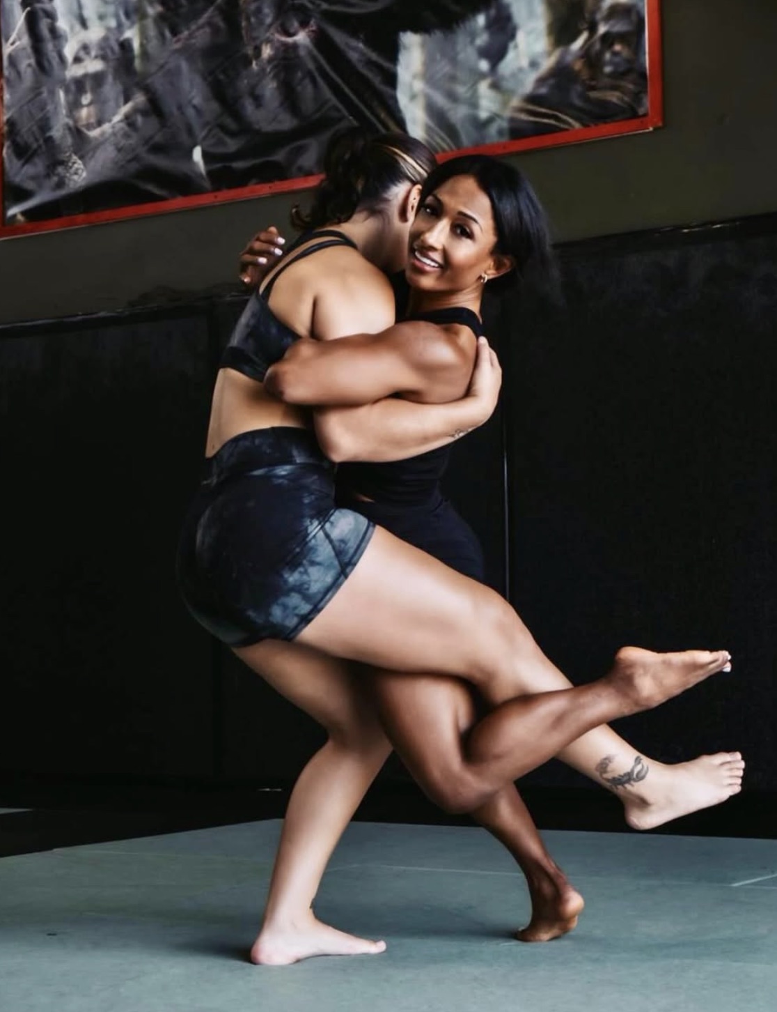 Victoria Anthony training with a partner in the gym
